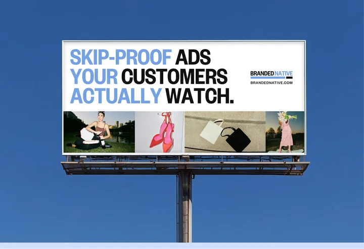 Branded Native billboard with black and blue lettering and lifestyle photographs against a blue sky.